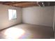 Unfinished basement with painted walls and visible window at 21444 E Lehigh Ave, Aurora, CO 80013