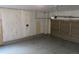 Interior view of garage featuring concrete floors and insulated walls at 21444 E Lehigh Ave, Aurora, CO 80013