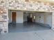 Open garage featuring concrete floors and insulated walls at 21444 E Lehigh Ave, Aurora, CO 80013