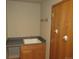 Functional laundry area with a sink, counter, and cabinet storage at 21444 E Lehigh Ave, Aurora, CO 80013