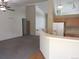 Open-concept living area with breakfast bar, wood floors, and access to kitchen, creating a welcoming flow at 21444 E Lehigh Ave, Aurora, CO 80013
