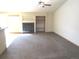 Cozy living area with fireplace, built-in shelving, and lots of natural light, perfect for relaxation at 21444 E Lehigh Ave, Aurora, CO 80013
