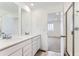 Bathroom with double sink vanity and shower at 587 Nightsky St, Erie, CO 80516