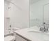 Bright bathroom featuring a shower over a tub and a modern vanity with quartz countertops at 587 Nightsky St, Erie, CO 80516