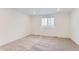 Cozy bedroom with neutral carpet and a window at 587 Nightsky St, Erie, CO 80516