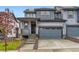 Charming two-story townhome with a two-car garage and welcoming front porch at 587 Nightsky St, Erie, CO 80516