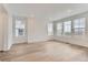 Spacious living area featuring wood flooring and lots of windows at 587 Nightsky St, Erie, CO 80516