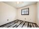 Bedroom with stylish floors and bright natural light from a window at 710 S Grand Ave, Fort Lupton, CO 80621
