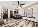 Bright living room with attractive floors, large window, and traditional design elements throughout at 710 S Grand Ave, Fort Lupton, CO 80621
