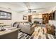 Open-plan living room with fireplace and dining area at 710 S Grand Ave, Fort Lupton, CO 80621