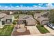 Aerial view of a well-maintained home with a front lawn, mature landscaping, and a two-car garage at 5400 S Quail Way, Littleton, CO 80127