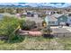 Aerial view of the fenced backyard with a deck and attractive landscaping at 5400 S Quail Way, Littleton, CO 80127