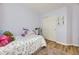 A cheerful bedroom features colorful decorations, comfortable bedding, and a spacious closet at 5400 S Quail Way, Littleton, CO 80127