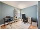 Functional home office with a workspace, a comfortable chair, and ample natural light for productivity at 5400 S Quail Way, Littleton, CO 80127