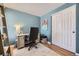 Cozy home office featuring neutral walls, wood floors, and a sliding-door closet for optimal organization at 5400 S Quail Way, Littleton, CO 80127