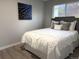 Cozy bedroom with stylish decor, a comfortable bed, and a bright window at 6880 Pontiac St, Commerce City, CO 80022