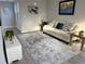 Cozy living room features fresh paint, modern floors, and furniture creating an inviting living space at 6880 Pontiac St, Commerce City, CO 80022