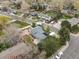 Aerial view capturing the neighborhood around the cozy home with white fence at 19093 W 61St Pl, Golden, CO 80403