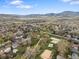 Wide aerial view showcasing the suburban community with mountain backdrops at 19093 W 61St Pl, Golden, CO 80403