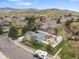 Suburban house featuring an outdoor fire pit area and mountain views at 19093 W 61St Pl, Golden, CO 80403