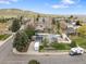 Expansive aerial shot of a charming home nestled in a lush, green neighborhood at 19093 W 61St Pl, Golden, CO 80403