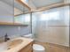 Bathroom featuring marble vanity, toilet, and glass enclosed shower with a rainfall shower head at 19093 W 61St Pl, Golden, CO 80403
