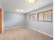 Bedroom with carpet floors and two windows with blinds at 19093 W 61St Pl, Golden, CO 80403