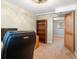 Home office with a desk, rolling chair, bookshelf, and open door with a view into another room at 19093 W 61St Pl, Golden, CO 80403