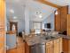 Open kitchen concept flowing into the living area, featuring stainless steel appliances and ample counter space at 19093 W 61St Pl, Golden, CO 80403