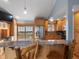 Modern kitchen featuring granite countertops, stainless steel appliances, and wooden cabinetry at 19093 W 61St Pl, Golden, CO 80403