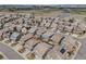 Aerial view of the neighborhood with landscaping, ponds, and modern buildings at 12677 Fisher Dr, Englewood, CO 80112