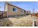 Backyard featuring a small yard and exterior of home at 12677 Fisher Dr, Englewood, CO 80112