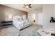 Main bedroom with a workspace and view of the ensuite bathroom at 12677 Fisher Dr, Englewood, CO 80112