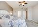 Spacious main bedroom with plush carpeting, ensuite bathroom and ceiling fan at 12677 Fisher Dr, Englewood, CO 80112