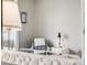 Bedroom sitting area reflected in the mirror at 12677 Fisher Dr, Englewood, CO 80112