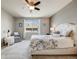 Well-lit bedroom with a view of the street at 12677 Fisher Dr, Englewood, CO 80112