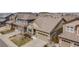 Inviting two-story home featuring stone accents, a two-car garage, and well-maintained landscaping in a suburban neighborhood at 12677 Fisher Dr, Englewood, CO 80112