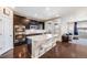 Modern kitchen with stainless steel appliances, granite countertops, and a large center island with seating at 12677 Fisher Dr, Englewood, CO 80112