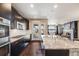 Bright kitchen with a large island, stainless steel appliances, and access to the backyard at 12677 Fisher Dr, Englewood, CO 80112