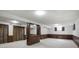 Spacious finished basement with wood paneled walls and ample storage at 8893 W Harvard Dr, Lakewood, CO 80227