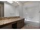 Bathroom featuring a large mirror, tile flooring and granite countertops at 8893 W Harvard Dr, Lakewood, CO 80227