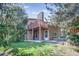 View of the home exterior with a second story deck and backyard at 8893 W Harvard Dr, Lakewood, CO 80227