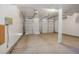 A spacious two-car garage features a sealed floor and ample lighting at 8893 W Harvard Dr, Lakewood, CO 80227