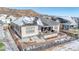 Aerial view of backyard with patio and covered porch, rock landscaping at 6066 Leilani Dr, Castle Rock, CO 80108