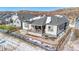 Aerial view of backyard featuring a covered porch, rock landscaping, and a black fence at 6066 Leilani Dr, Castle Rock, CO 80108
