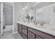 Bathroom boasts double sinks, a large mirror, and modern fixtures at 6066 Leilani Dr, Castle Rock, CO 80108