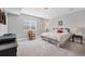 Cozy bedroom with neutral tones, plush carpet, and a comfortable queen-sized bed at 6066 Leilani Dr, Castle Rock, CO 80108