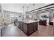 Spacious kitchen island with bar seating, open to the dining and living areas for seamless entertaining and Gathering gatherings at 6066 Leilani Dr, Castle Rock, CO 80108