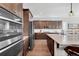 Gourmet kitchen boasts stainless appliances, granite countertops, and abundant storage, perfect for culinary enthusiasts at 6066 Leilani Dr, Castle Rock, CO 80108