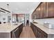 Spacious kitchen features a large island with granite countertops and stainless steel appliances at 6066 Leilani Dr, Castle Rock, CO 80108